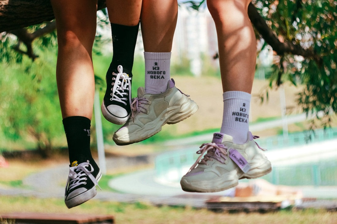 woman in black shorts and white nike sneakers