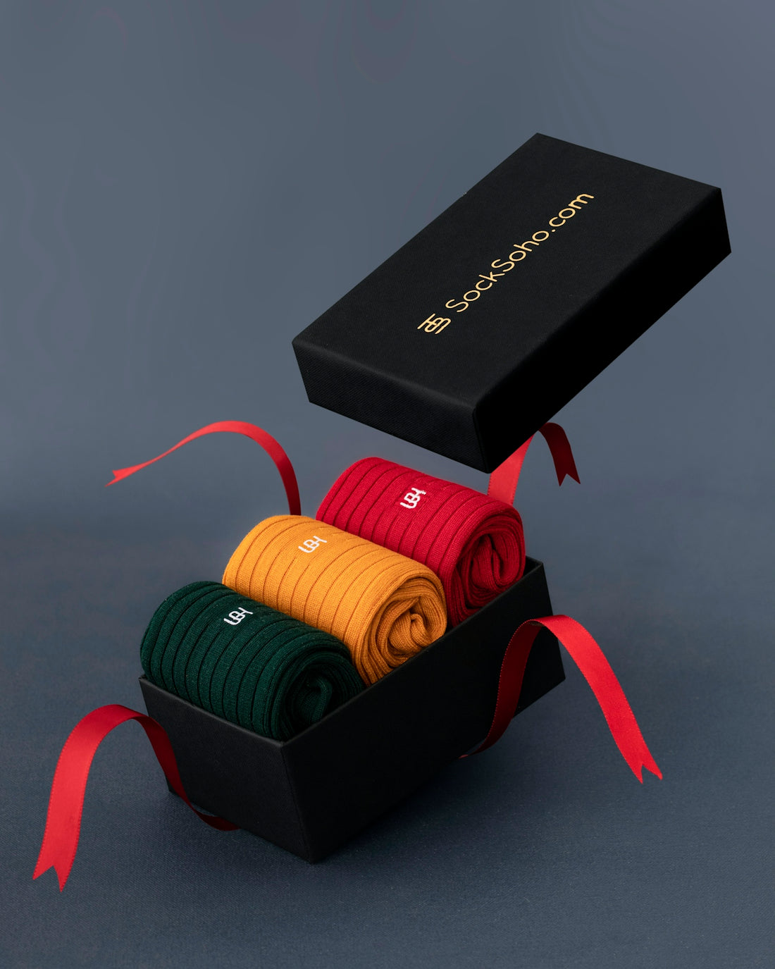 a black box with four pairs of socks in it