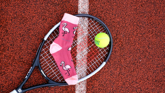 A tennis racket and ball on a tennis court
