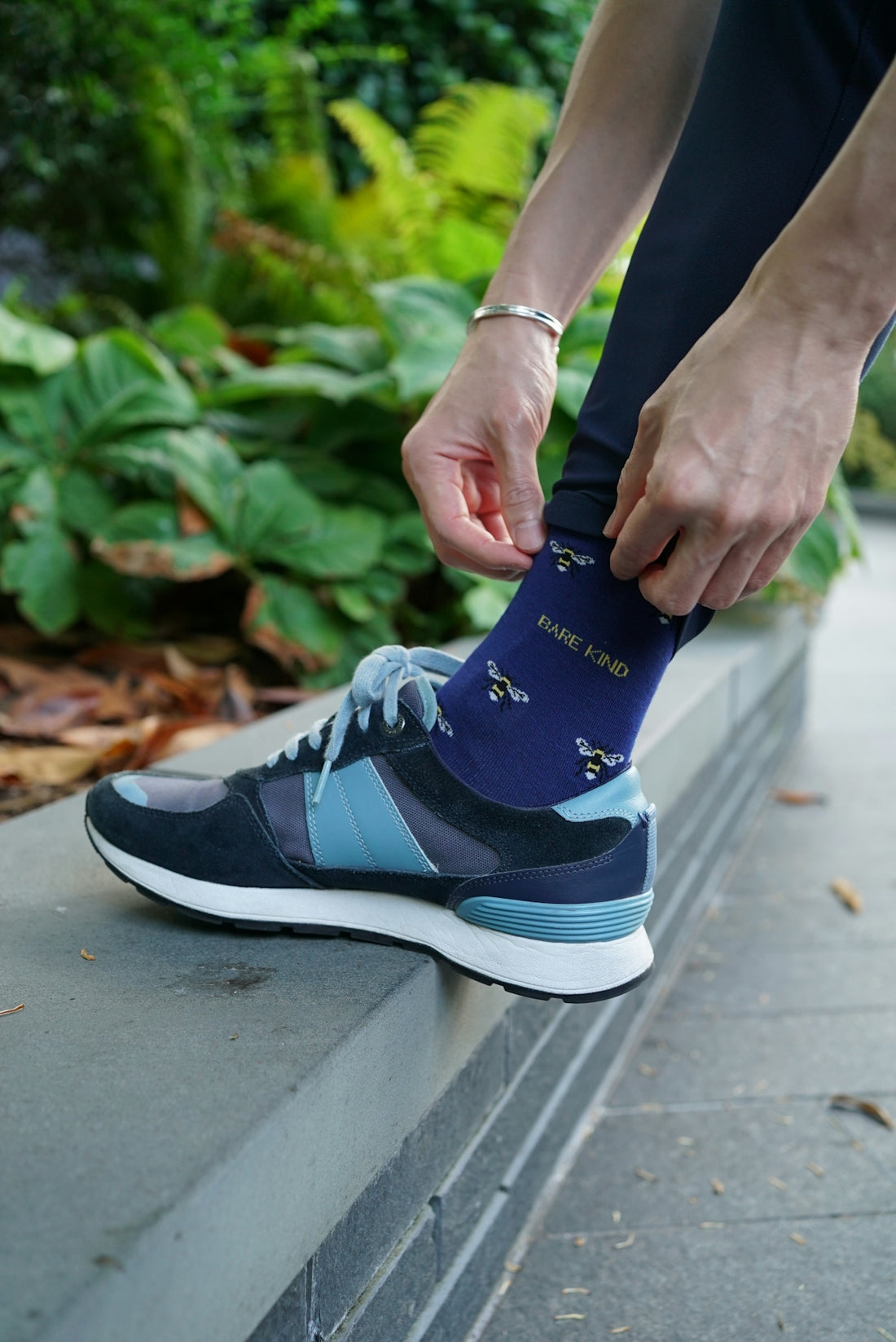 A person putting on a pair of socks