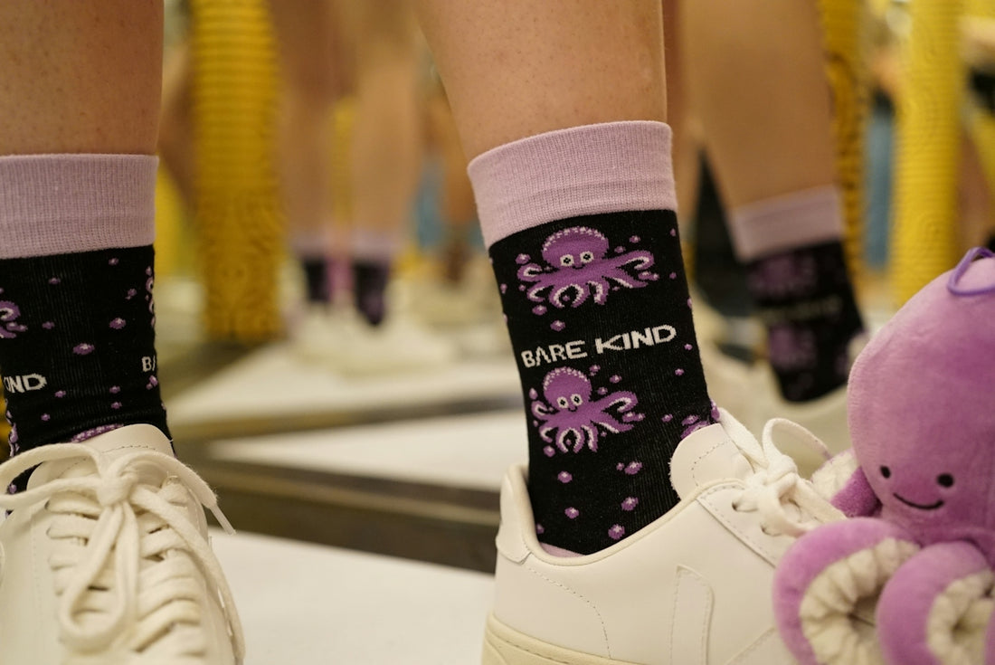 A close up of a person's legs with octopus socks