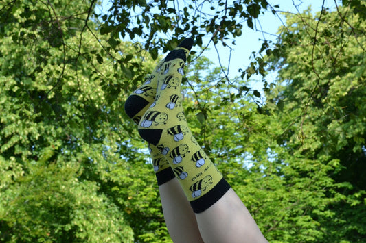 A woman's legs with black and yellow socks