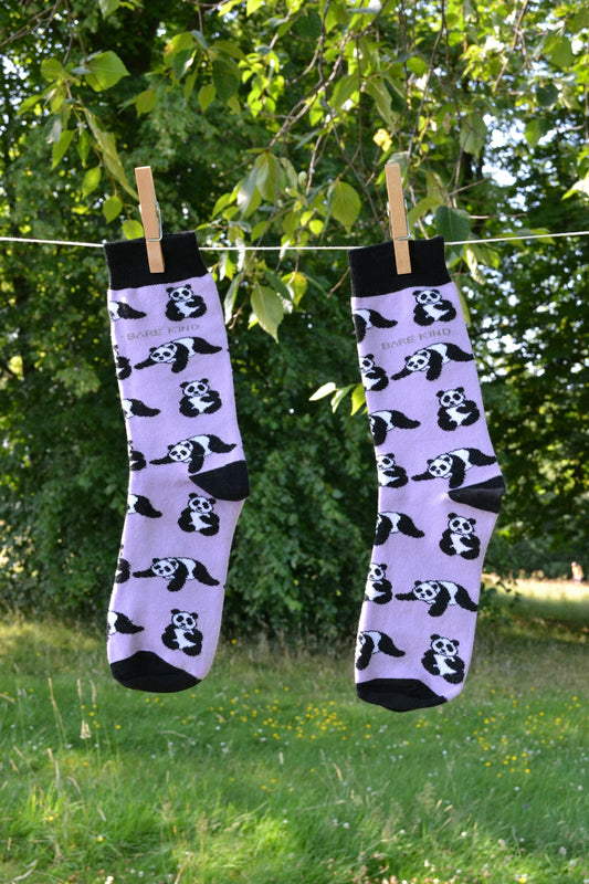 A couple of socks hanging from a clothes line