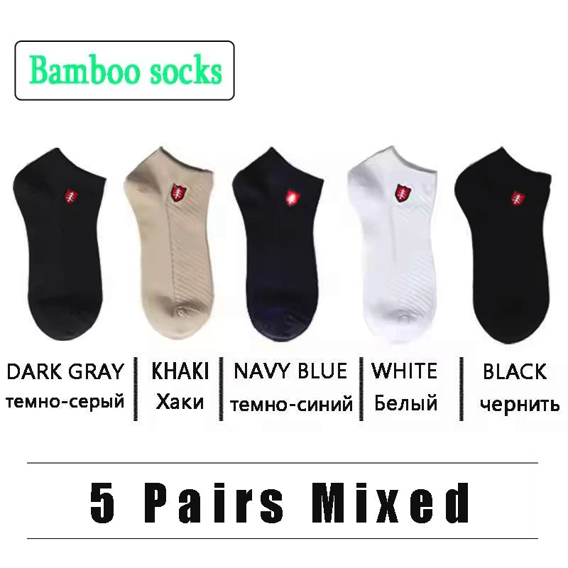 Five pairs of bamboo socks in dark gray, khaki, navy blue, white, and black for comfort and style.