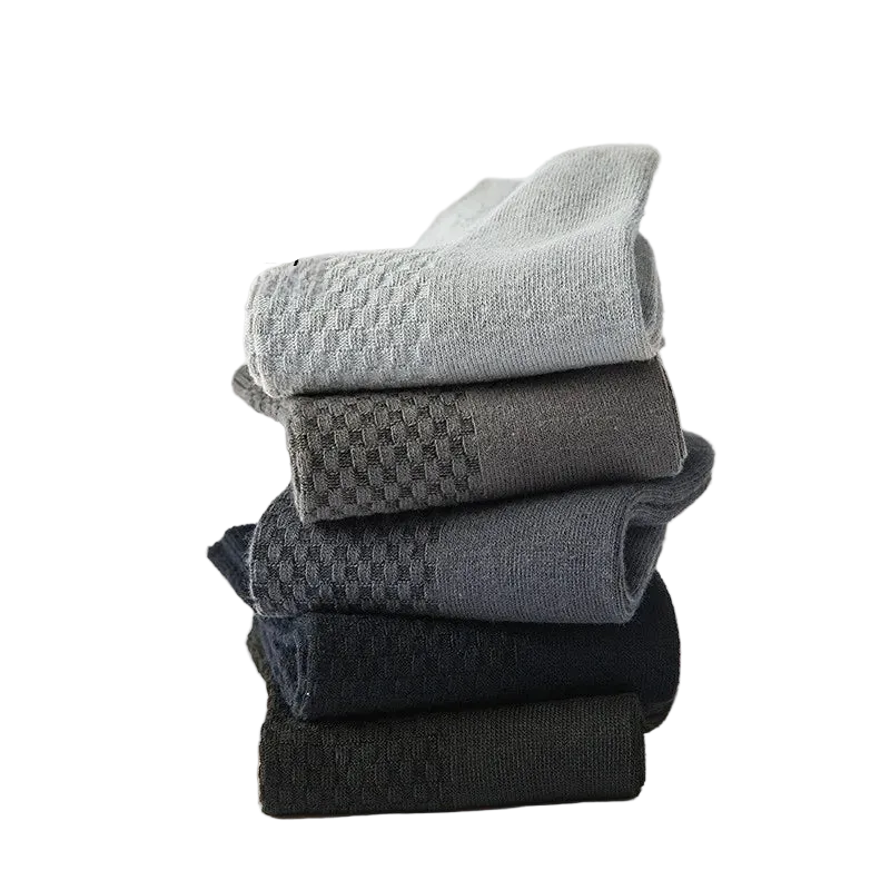 Set of soft cotton socks in various grey shades, featuring a textured pattern and breathable design.