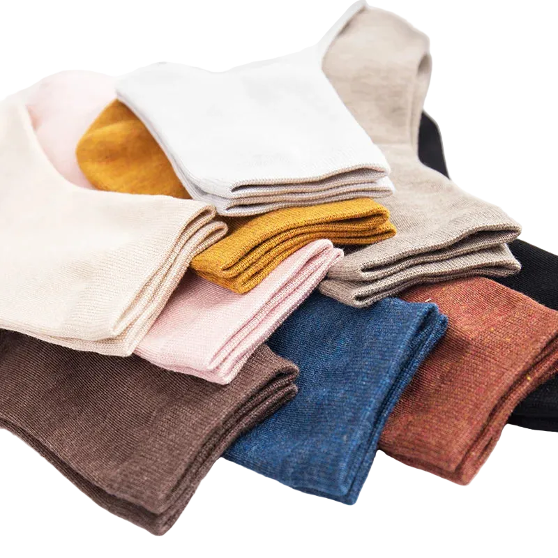 Assorted cotton ankle socks in various colors: white, pink, brown, yellow, and more.