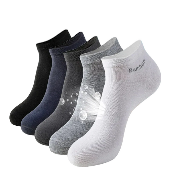 Set of bamboo ankle socks in black, gray, and white. Soft, breathable, and moisture-wicking material.