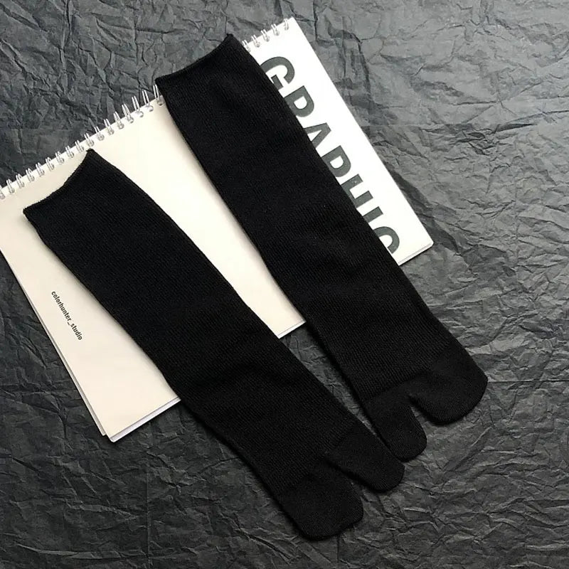 Stylish black toe socks made from soft cotton, perfect for comfort and everyday wear.