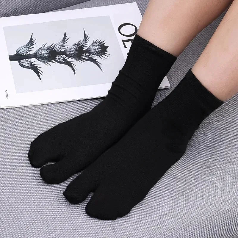 Black toe socks made from soft material, offering comfort and unique five-toe design for an enhanced fit.
