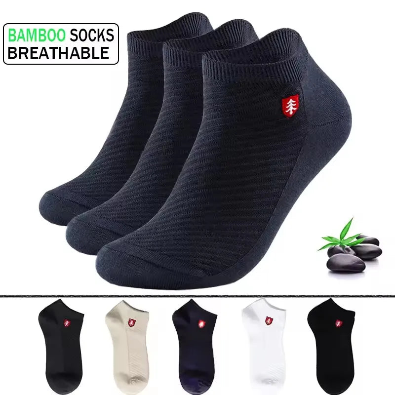 Set of three breathable bamboo socks in black, gray, and white, designed for comfort and durability.