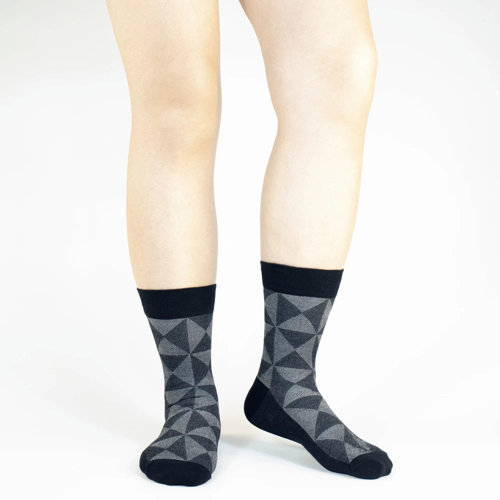 Men's black and gray patterned socks made of soft, breathable material for comfort and style.