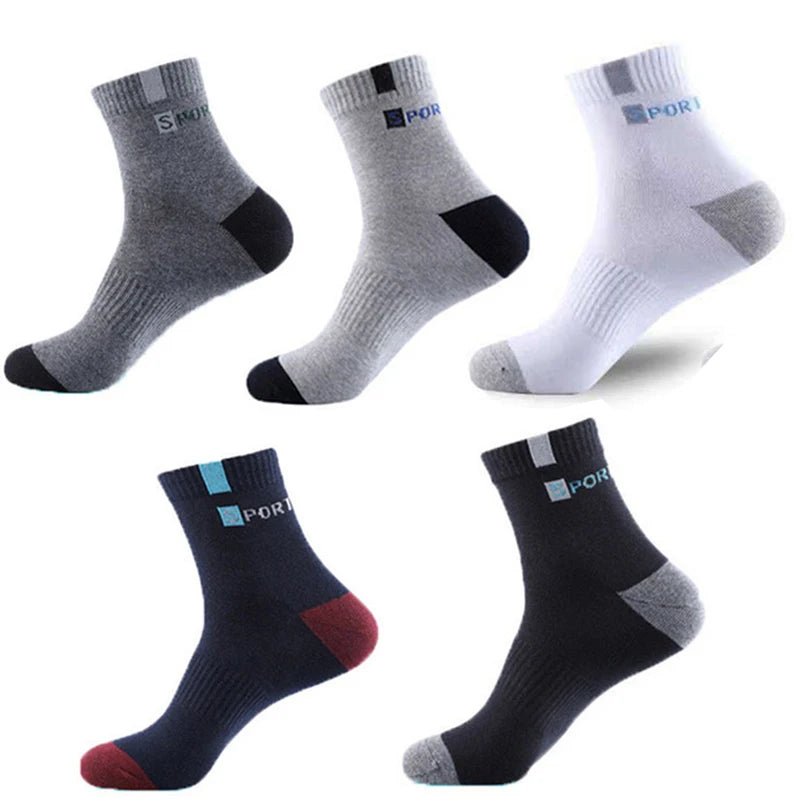 Assorted sports socks in gray, white, and black with ribbed texture and logo for comfort and style.