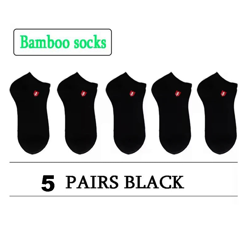 Five pairs of black bamboo socks, soft and breathable for comfort during wear.