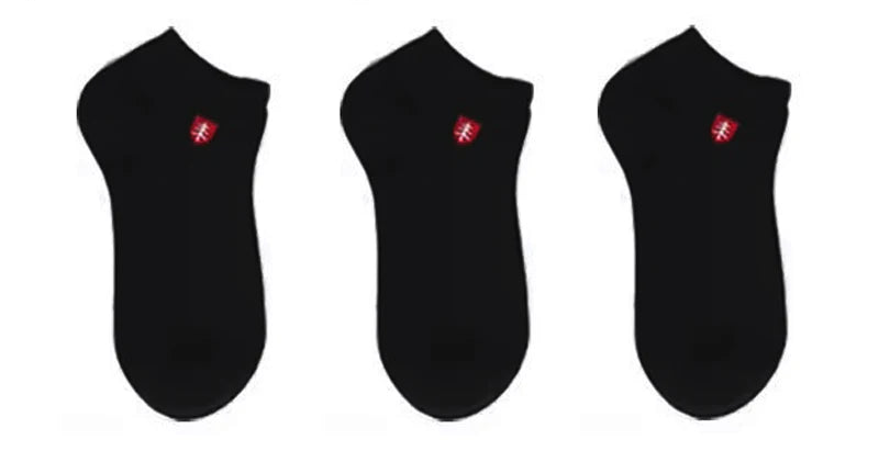 Pack of three black ankle socks with red logo, made from soft cotton blend for comfort and durability.
