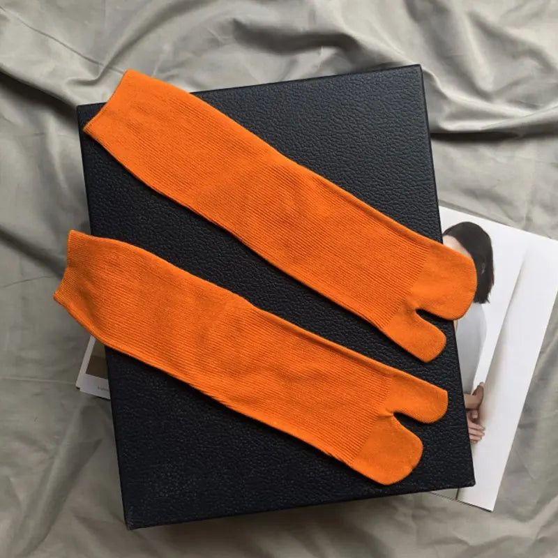 Vibrant orange cotton toe socks for comfort and style, perfect for casual wear.